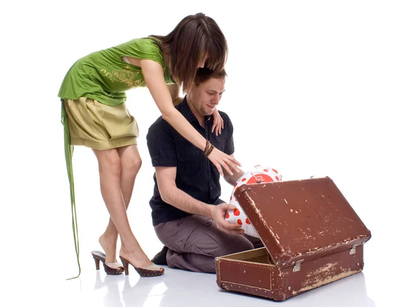 Couple opens a suitcase with a surprise — Stock Photo, Image