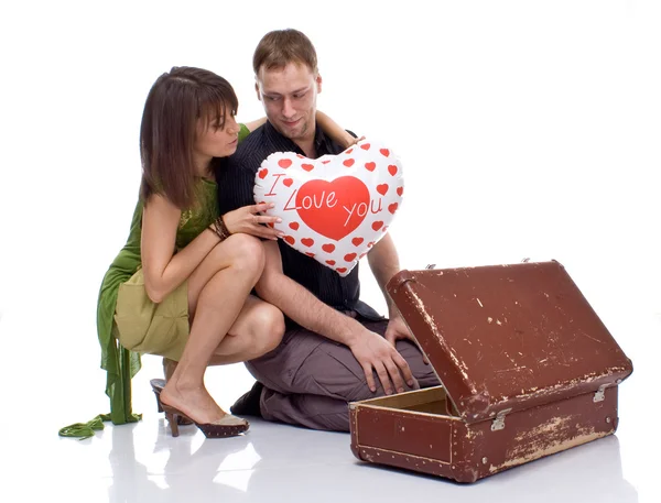 Couple opens a suitcase with a surprise — Stock Photo, Image