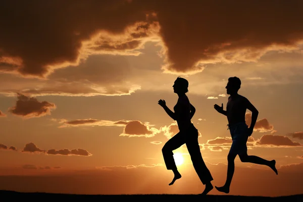 Running during sunset — Stock Photo, Image