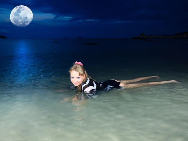 Swimming under moon — Stock Photo, Image