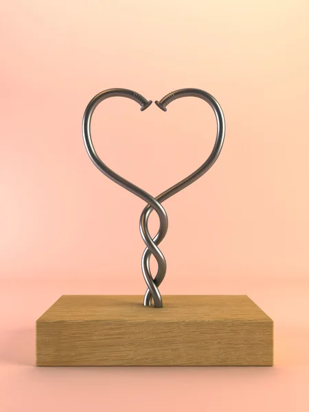 Dva kroucené hřebíky ve tvaru srdce — Stock fotografie