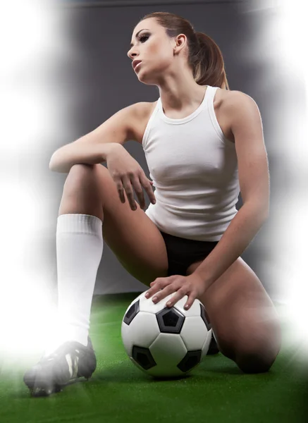 Sexy football player on stadium Stock Picture
