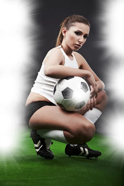 Sexy football player on stadium Stock Image