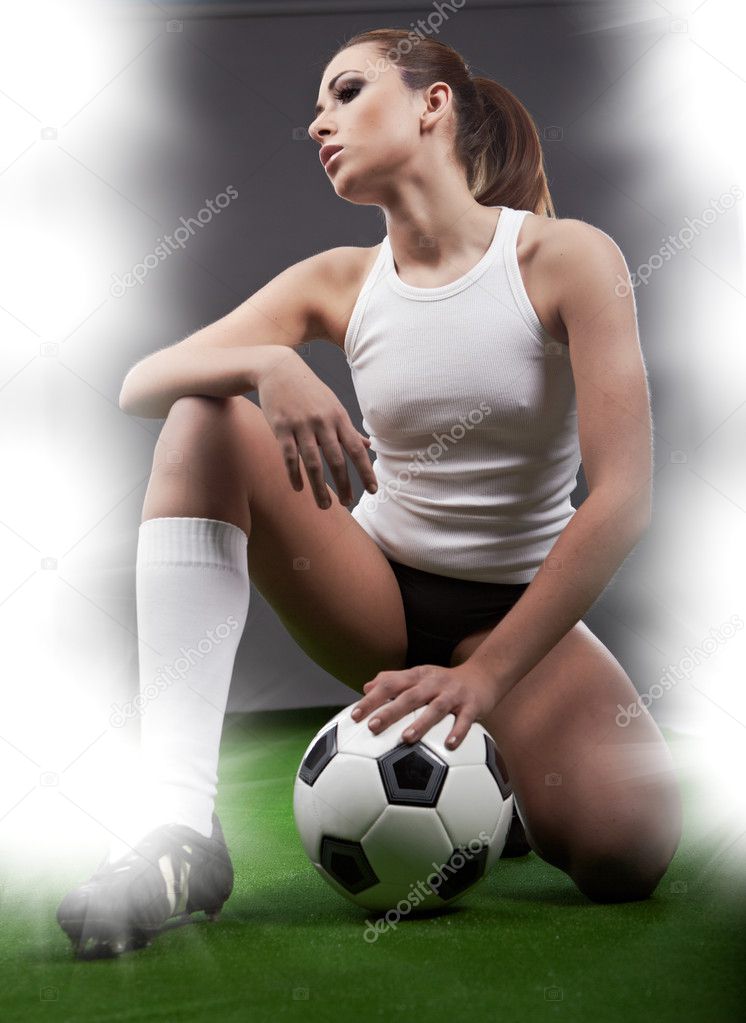 Sexy football player on stadium