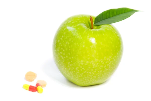 stock image Green apple and pills