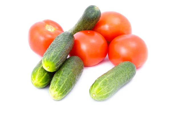 Fresh green cucumbers and red tomatoes isolated on the white — Stock Photo, Image