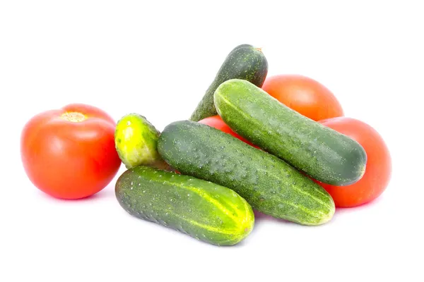 stock image Fresh cucumbers and tomatoes isolated on the white