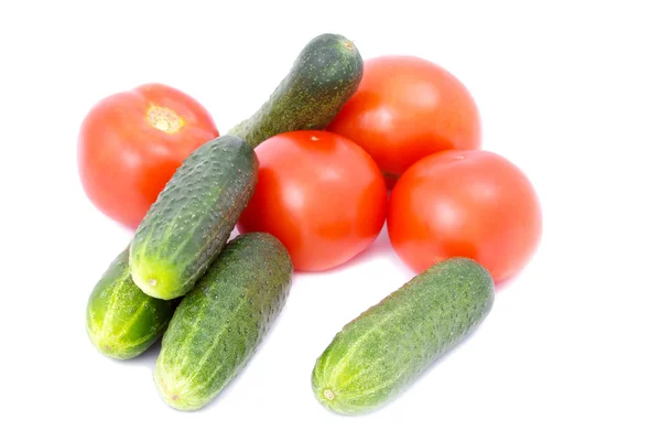 Fresh cucumbers and tomatoes isolated on white background — Stock Photo, Image