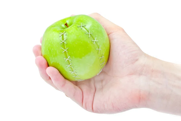 Zielone jablko w męskiej ręki — Zdjęcie stockowe