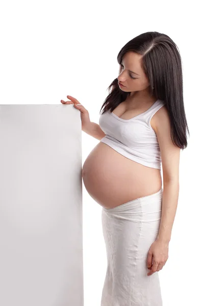 Femme enceinte avec pancarte — Photo