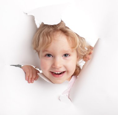 Child looking out of a hole clipart