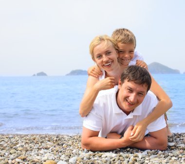 Family on the beach clipart
