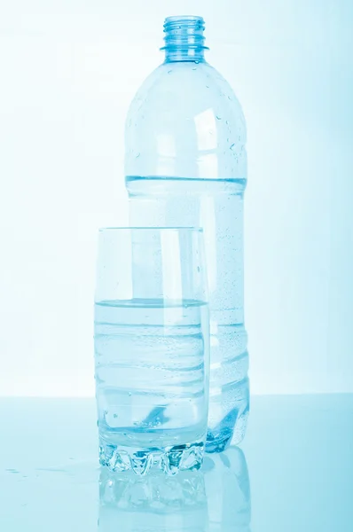 Glass of pouring water — Stock Photo, Image
