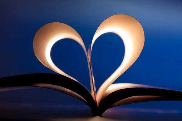 Open book in red heart shape — Stock Photo, Image