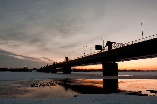River with bridge on sunset — Stok fotoğraf