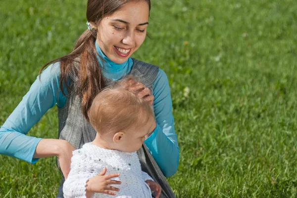 Mother and young daughter in the meadow — Stock Photo, Image