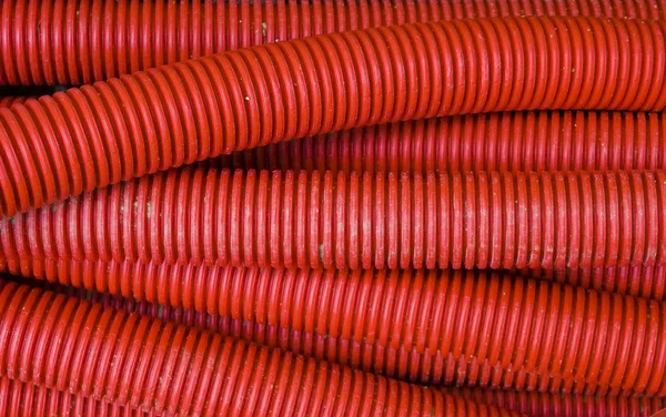 Tubulação corrugada vermelha — Fotografia de Stock