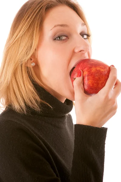 Chica muerde manzana — Foto de Stock