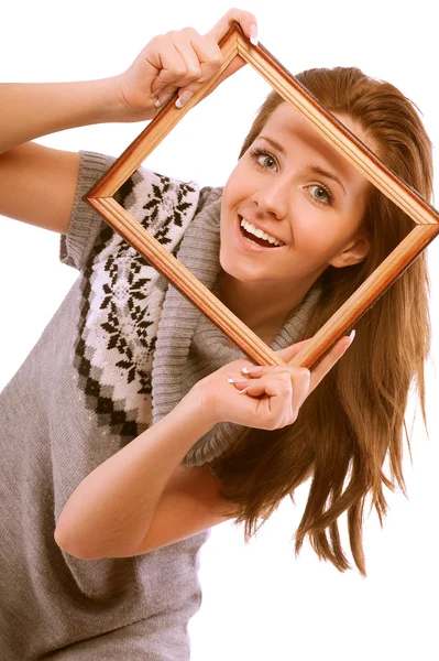 Chica mira a través de marco — Foto de Stock