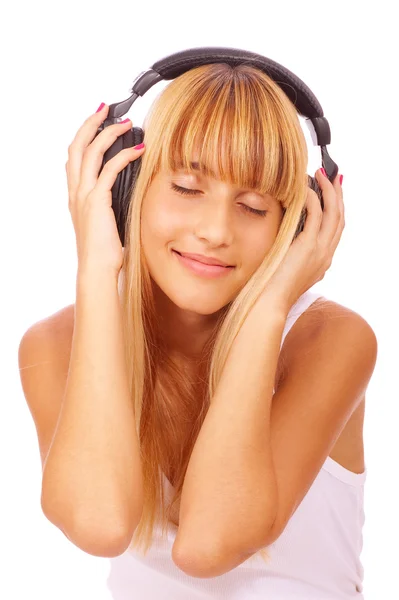 Oldukça genç bir kız müzik dinlemek — Stok fotoğraf