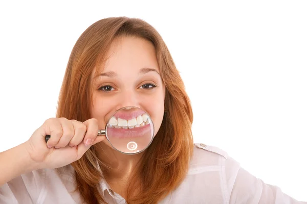 stock image Teeth of young woman through magnifier