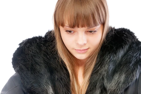 Beautiful young woman in winter fur coat — Stock Photo, Image