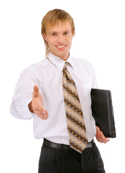 Smiling businessman with phone gives hand — Stock Photo, Image