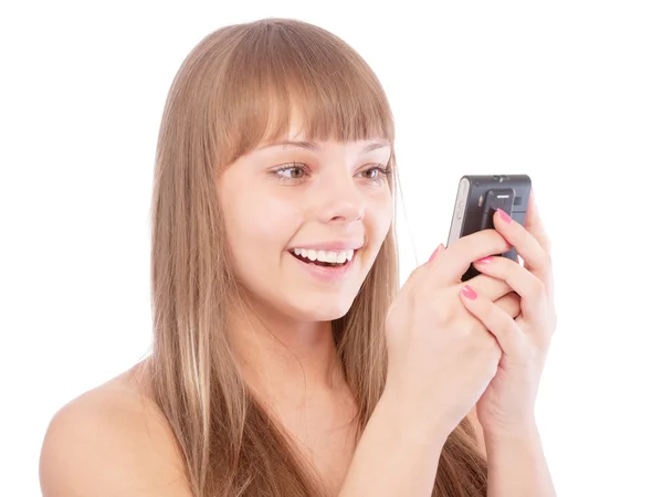 Beautiful girl read sms by phone and laughs — Stock Photo, Image