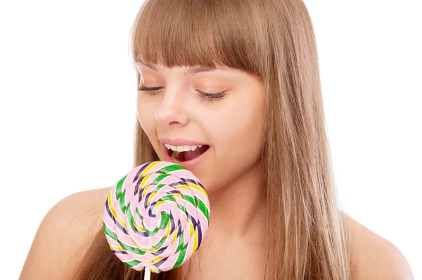 Young girl licks lollipop — Zdjęcie stockowe