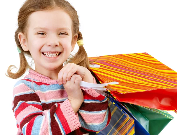 Κοριτσάκι με πολύχρωμα πακέτα — Φωτογραφία Αρχείου
