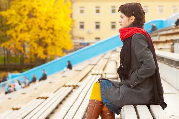 Girl with red scarf at stadium — Stock Photo, Image