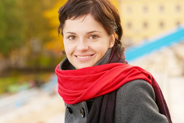Beautiful girl with red scarf — Stock Photo, Image