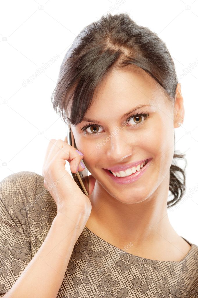 Smiling brunette speaks by mobile phone