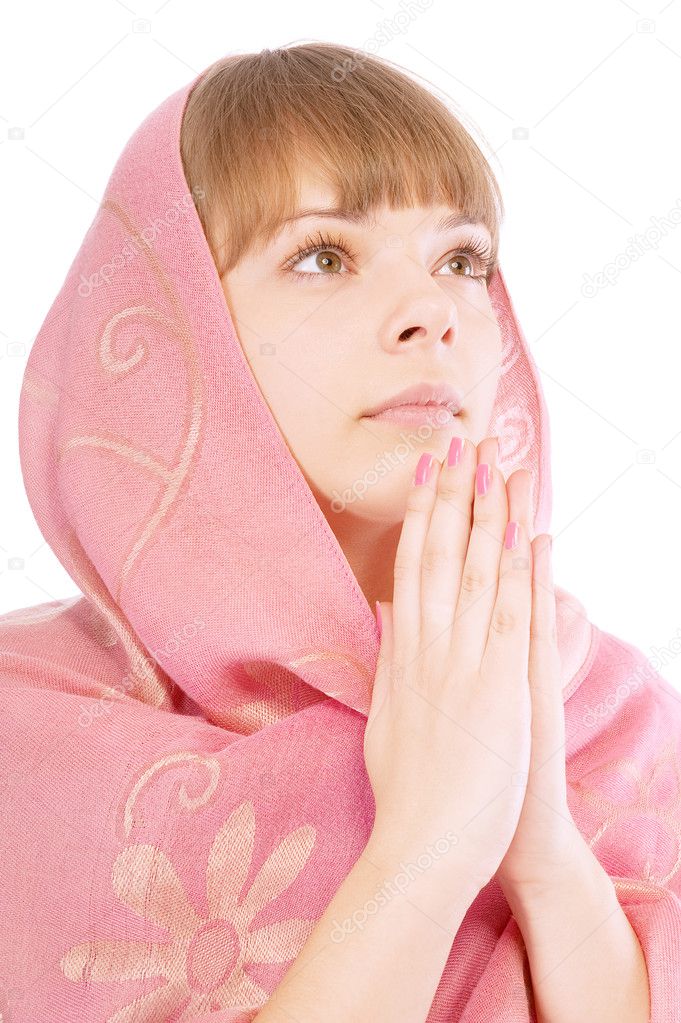 Portrait of beautiful young woman praying