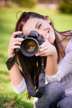 Beautiful girl with camera clipart