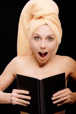 Amazed young woman is covered with book clipart