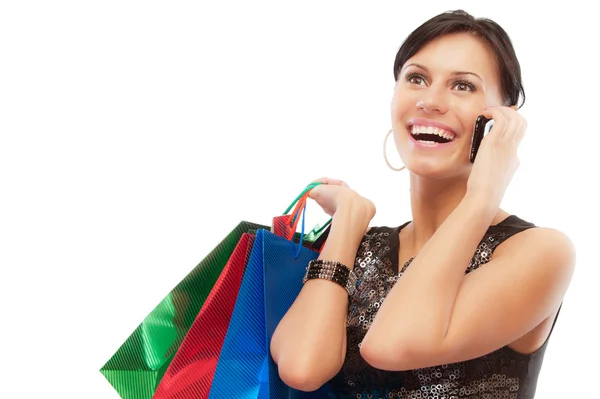 Charming girl with purchases speaks by phone — Stock Photo, Image