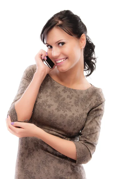 Smiling brunette speaks by mobile phone — Stock Photo, Image