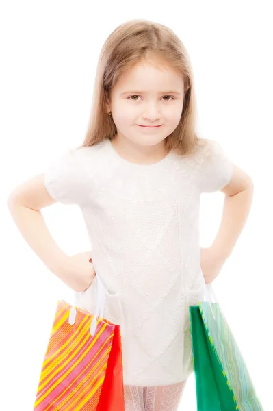 Retrato de criança pré-escolar bonita com pacotes — Fotografia de Stock