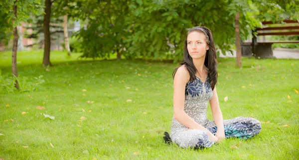 Young girl has rest on lawn — Stock Photo, Image
