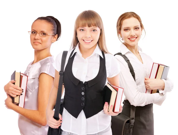 Três lindas meninas-estudantes com livros didáticos — Fotografia de Stock