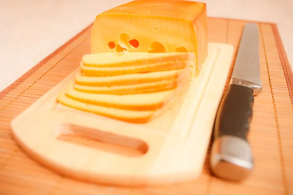 Cut cheese and knife — Stock Photo, Image