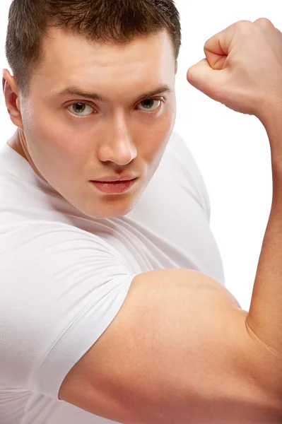 Potężne ciało budowniczego pokazuje biceps — Zdjęcie stockowe