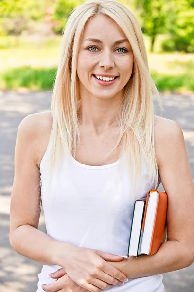 Girl-student with textbook — Stock Photo, Image