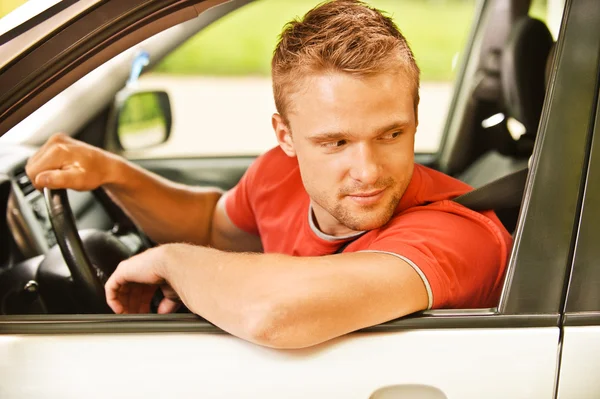 Driver of car looks back — Stock Photo, Image