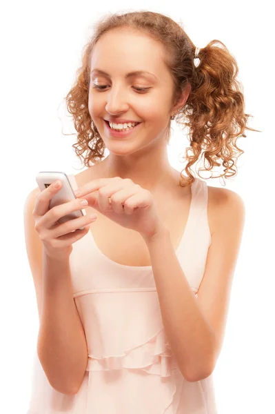Smiling girl dials number on phone — Stock Photo, Image