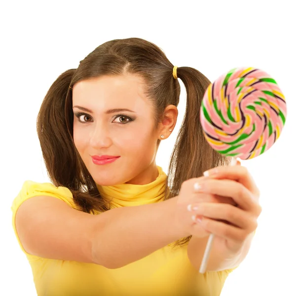 Girl with plaits holds lolipop — Stock Photo, Image