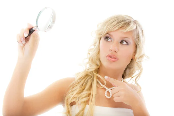 Girl looks in magnifier and is surprised — Stock Photo, Image