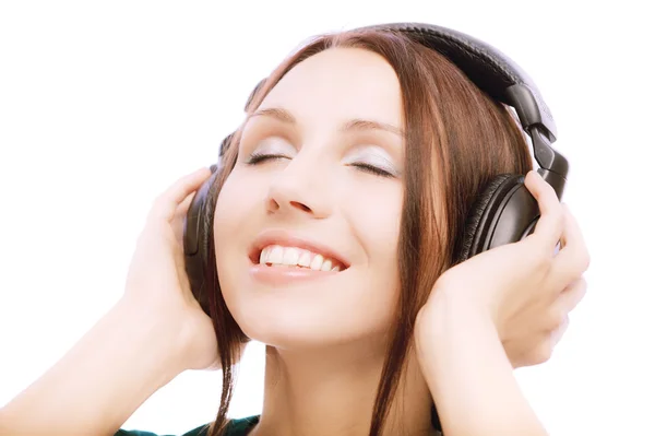 Linda menina sorridente em fones de ouvido — Fotografia de Stock