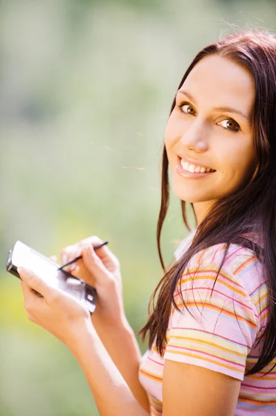 Young nice woman with PDA — Stock Photo, Image